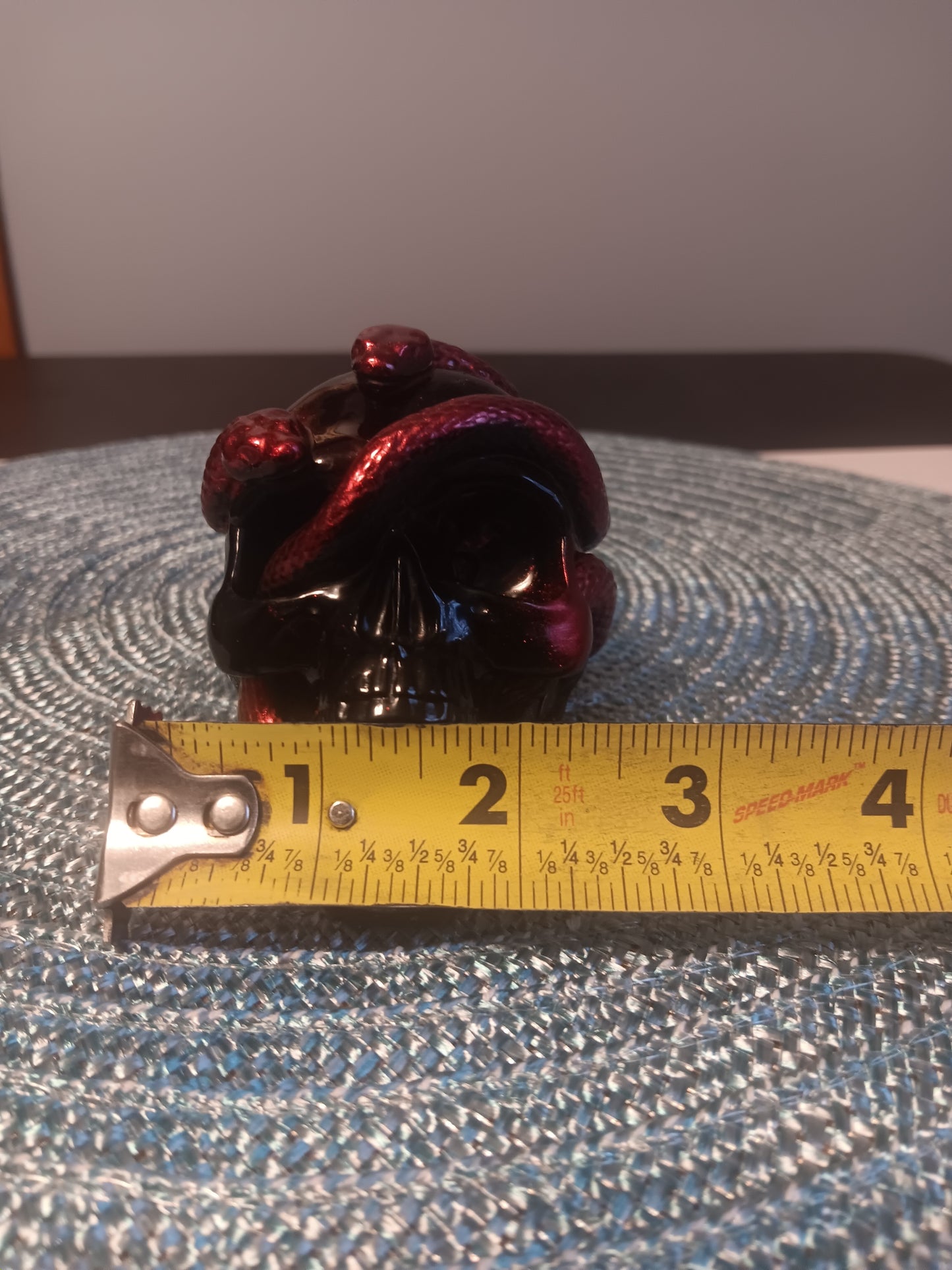 Small Black Skull intertwined with Red Snakes